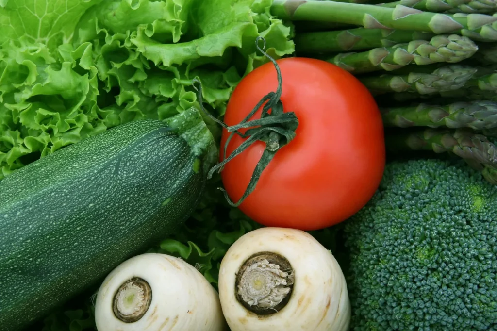 A vibrant close-up of fresh vegetables, including tomato, zucchini, and broccoli, perfect for health